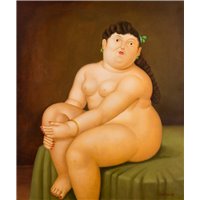 Женшина, сидящая на кровати